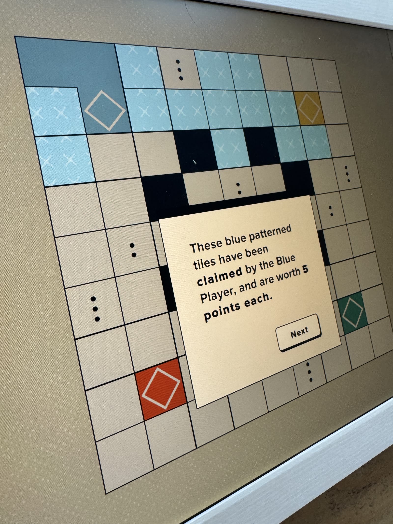 Tutorial highlighting patterned blue claimed tiles.