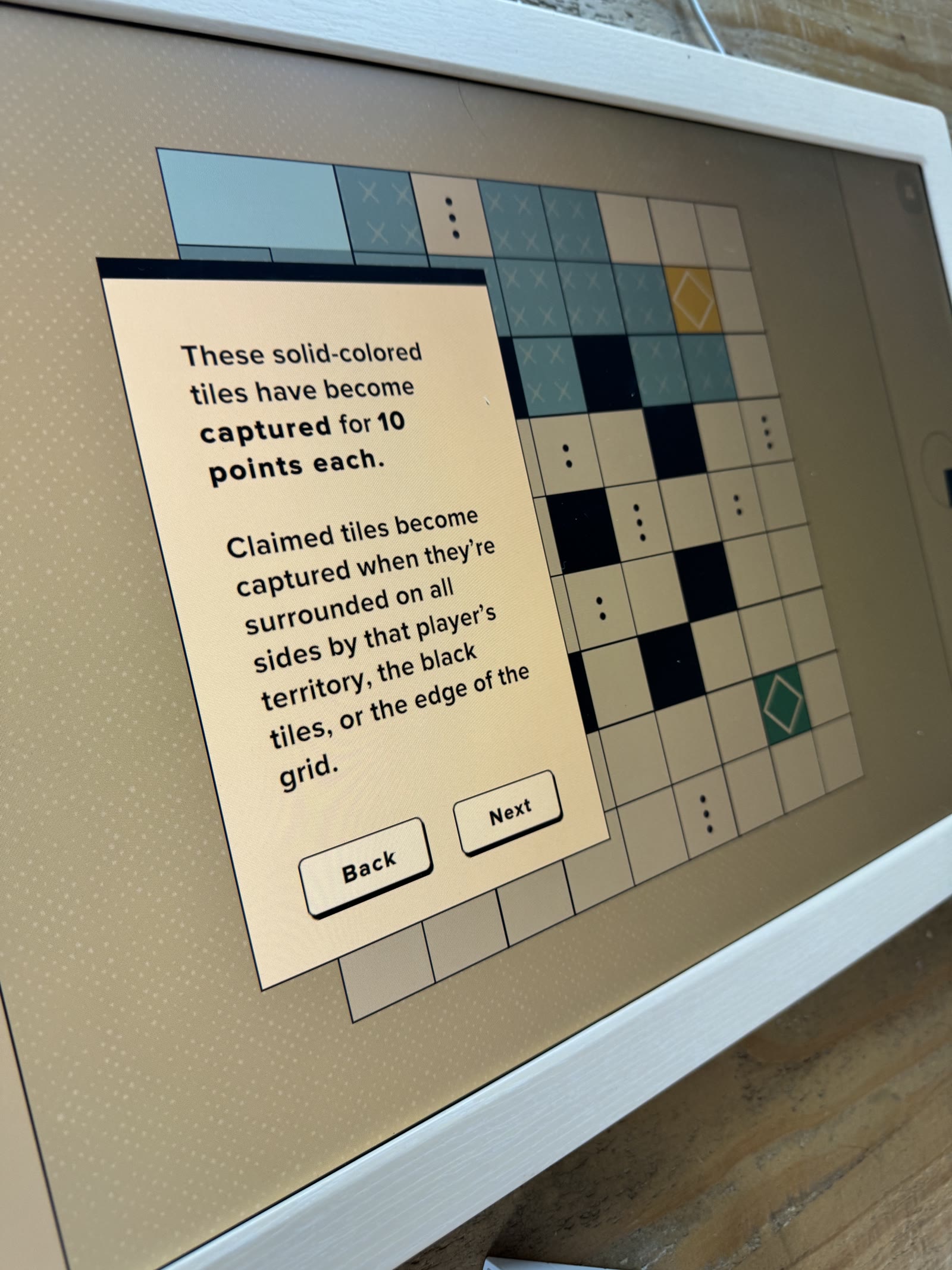 Tutorial explaining solid blue captured tiles and enclosure.