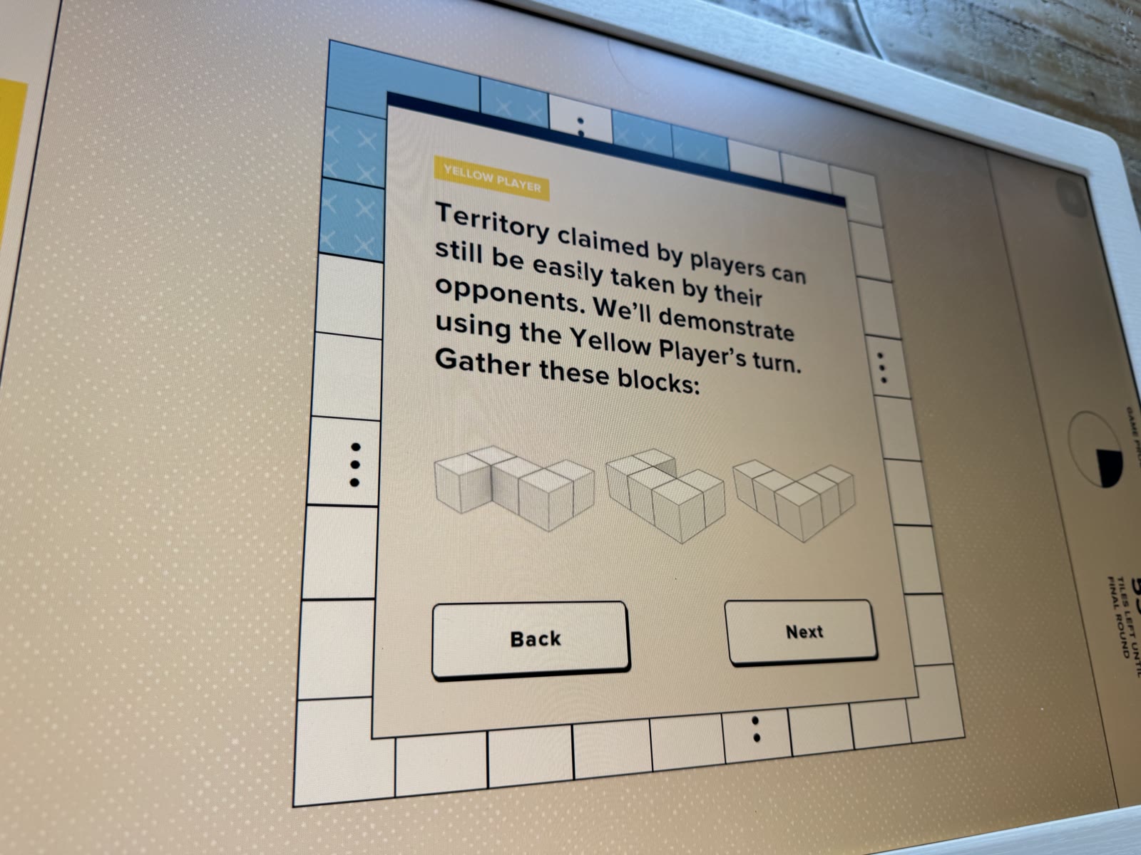 Yellow Player tutorial showing three blocks used to take Blue territory.