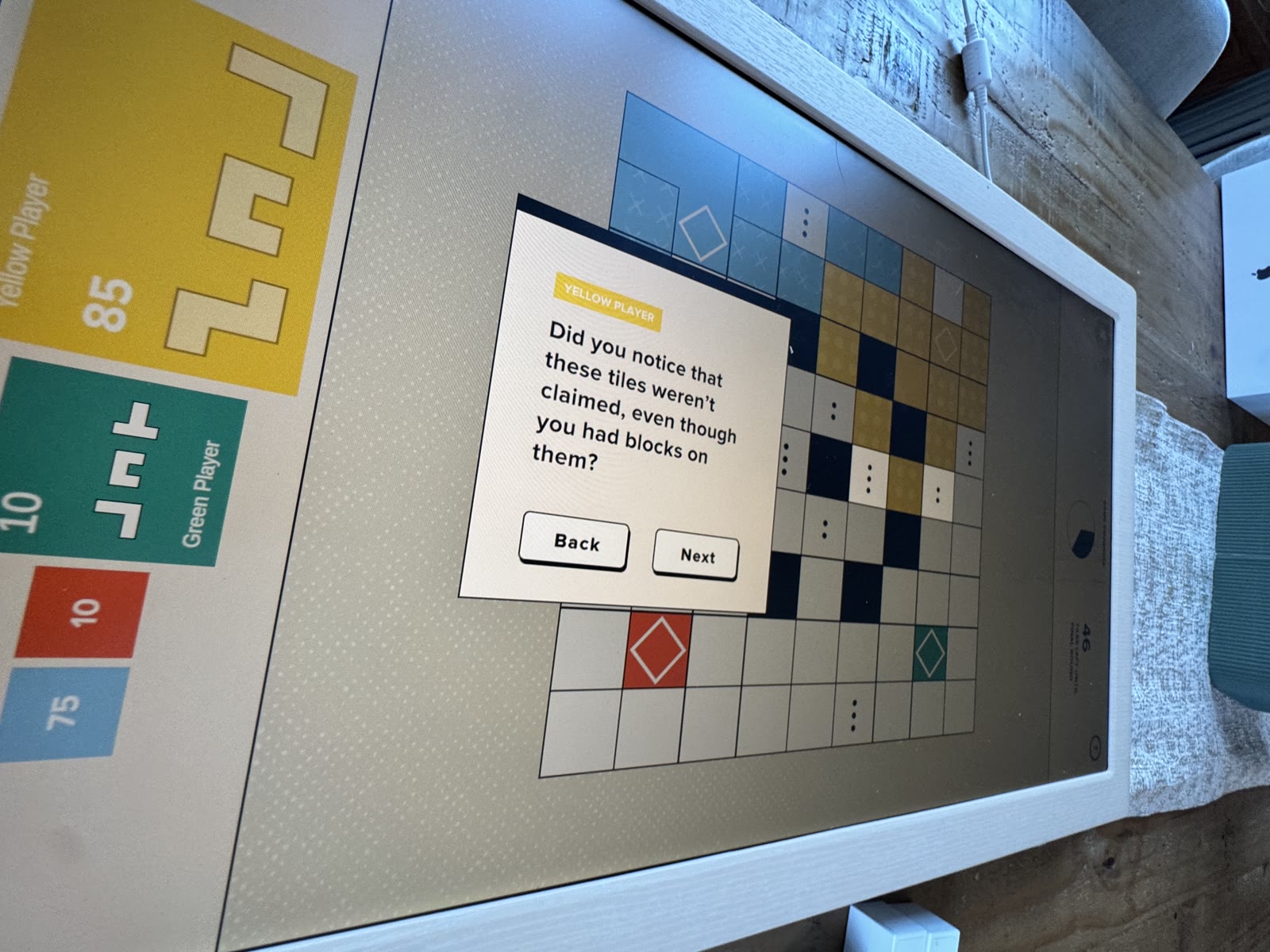 Tutorial question pointing out unclaimed dotted height tiles.