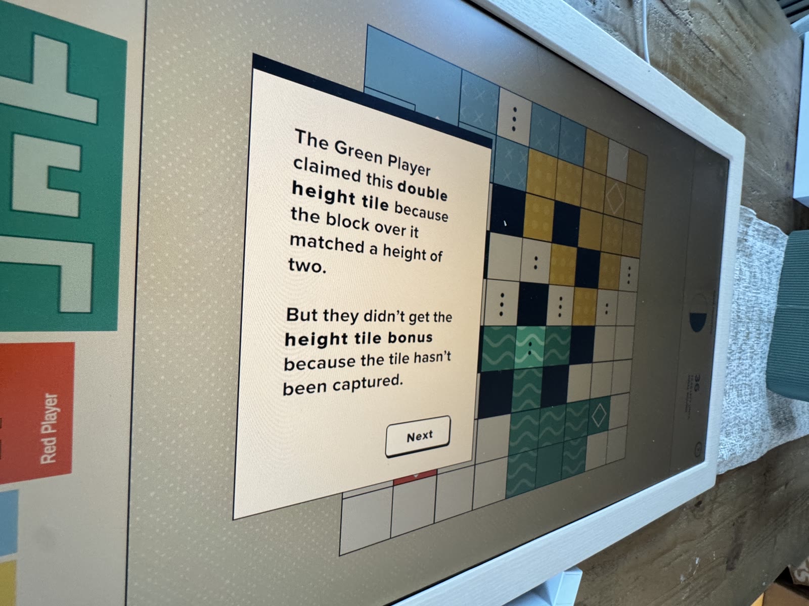 Green double-height tile that is claimed but not captured.