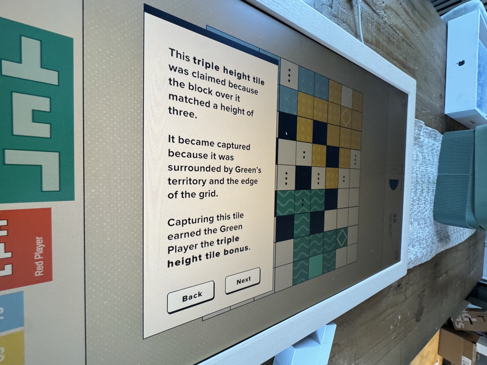 Captured Green triple-height tile enclosed at the grid edge.